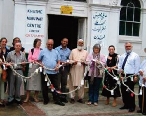 Clapham & Stockwell Faith Forum members outside Khatme Nubuwwat Centre 7th July 2006 after holding a two-minute silence together. The rope Peace Mala demonstrated the leaders’ determination to work together to find non-violent solutions to current difficulties.