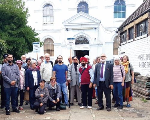 Faith and community leaders stand at Khatme Nubuwwat Centre for the Interfaith Walk 2018.