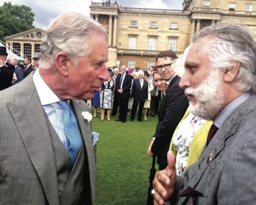 Speaking to HRH Prince Charles during a gathering for The Queen’s Birthday Party at Buckingham Palace. 2014.