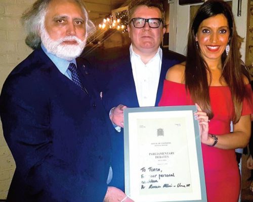 Labour Party’s former Deputy Leader Tom Watson MP and Rosena AllinKhan MP presenting her signed introductory parliamentary speech at a dinner after discussing far right and Islamophobic groups growing in the UK and their plans to tackle these organisations.