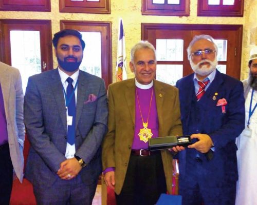 Presenting a memento to the Anglican Bishop of Jerusalem Suheil Dawani during an interfaith dialogue with him at his residence in Jerusalem, Palestine as part of the “Sharing Perspectives: Muslims and Christians in the Holy Land” alongside Bishop Richard Cheetham, Umar and Shaykh Ibrahim Mogra.